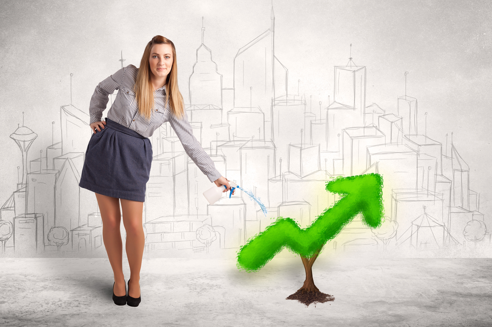 Business woman watering green plant arrow concept on background-1